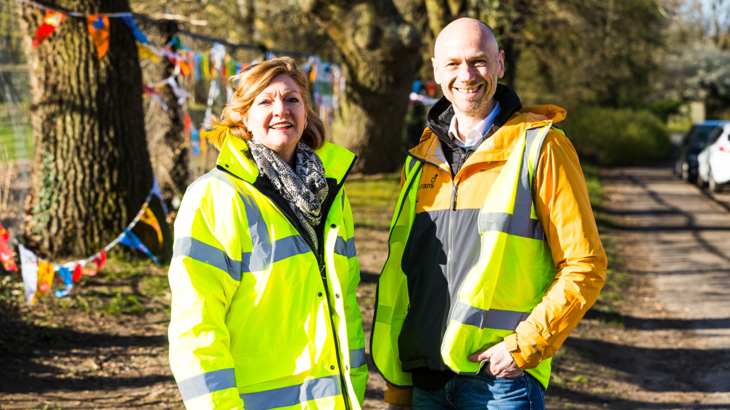 James Cleeton, pictured wearing a high-vis jacket, attends a School Streets street closure at Fairisle School, Southampton. Bunting is hung in the trees in the background.