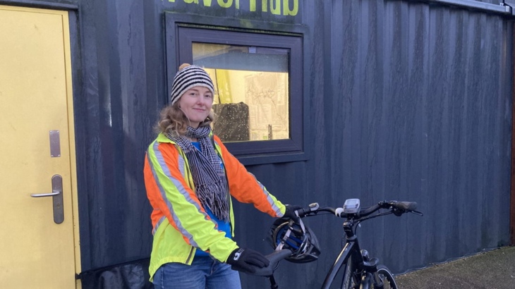 Meabh Cormacain with her e-bike outside the Walk Wheel Cycle Trust active travel hub