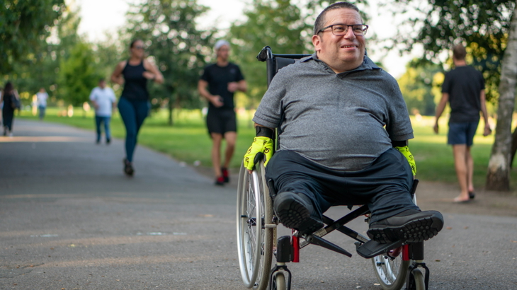 Man in wheelchair on shared use path