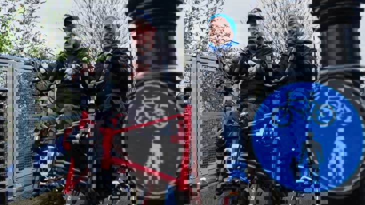 Man and woman using adapted bike on walking and cycling path