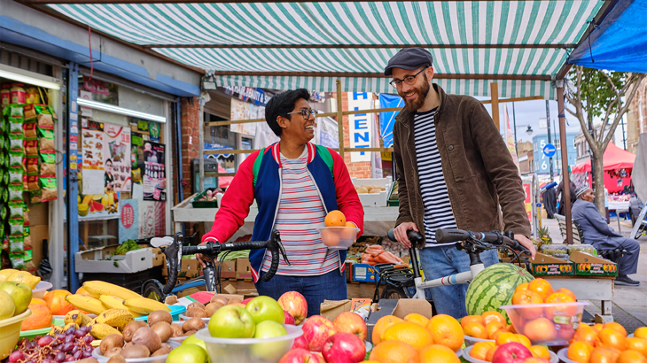 People Buying Food at a Street Market