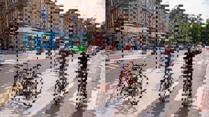 Two cyclists in a protected cycle lane