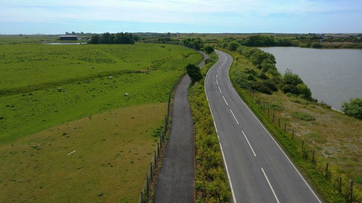 drone view of newly improved roadside walking, wheeling and cycling route. 