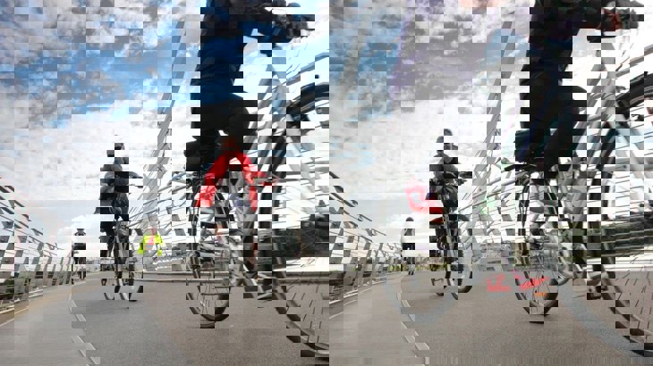 People on bikes on a cycling and walking bridge