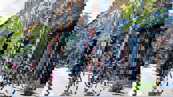 Male and female coworkers cycling side by side