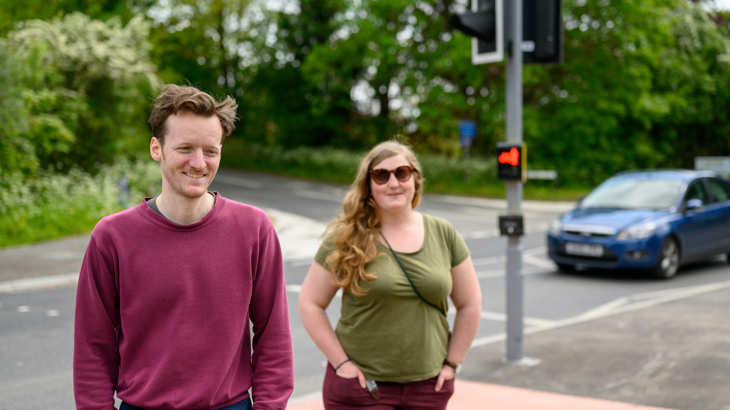 two people crossed a new improved crossing, installed as part of improvements to national cycle network route 544