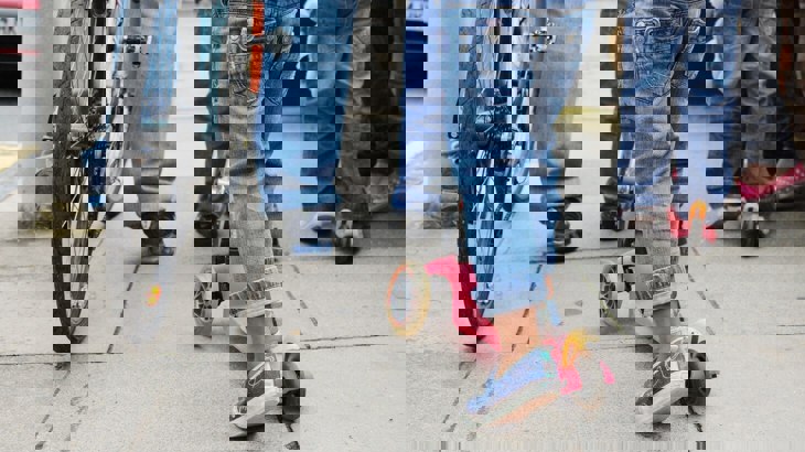 Adults and children walking and scooting 