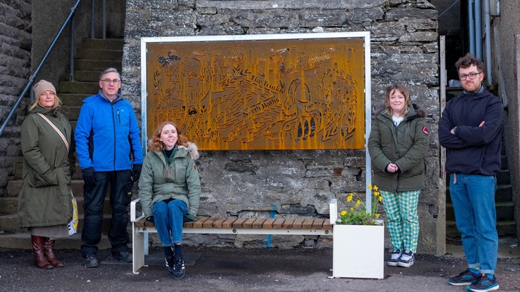 The project partners are pictured with one of artist Hannah Cambridge's artworks.