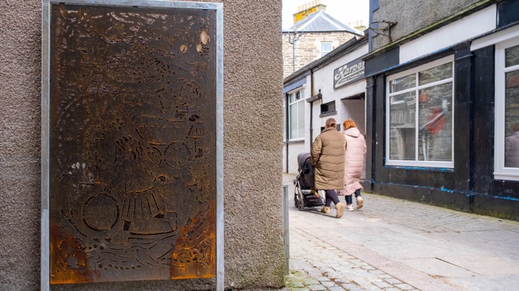 Residents walk near an artwork by Aimee Lockwood that has been installed in Wick.