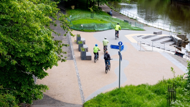 A group of people cycle through the newly opened Coalie Park on National Cycle Network Route 75 in Leith.