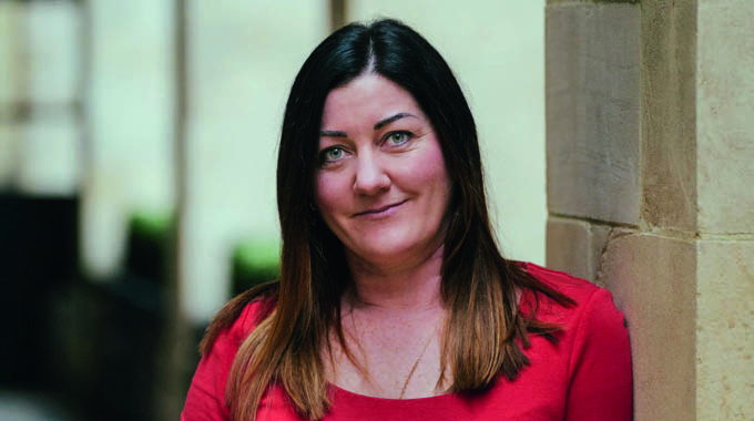 Headshot of Walk Wheel Cycle Trust Executive Director of Impact, Susie Dunham.