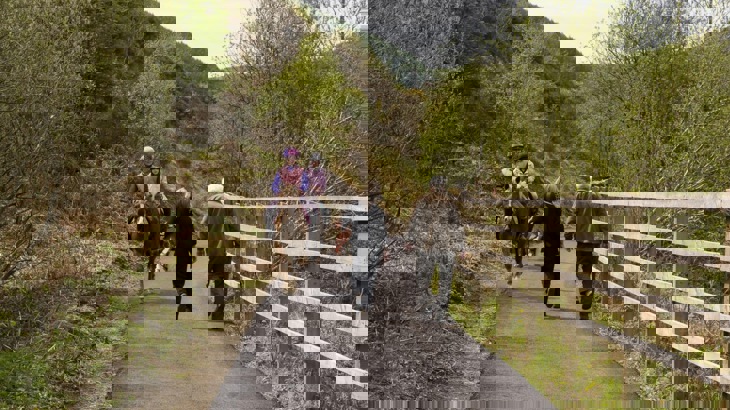 Two horse riders and two walkers on rural cycle path