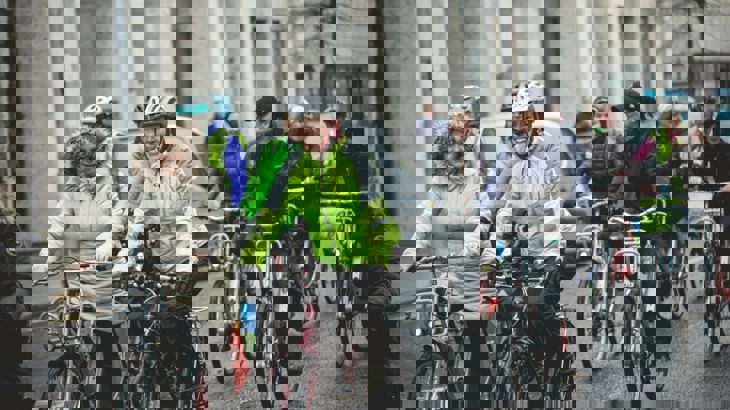 Group of people cycling along road in NI
