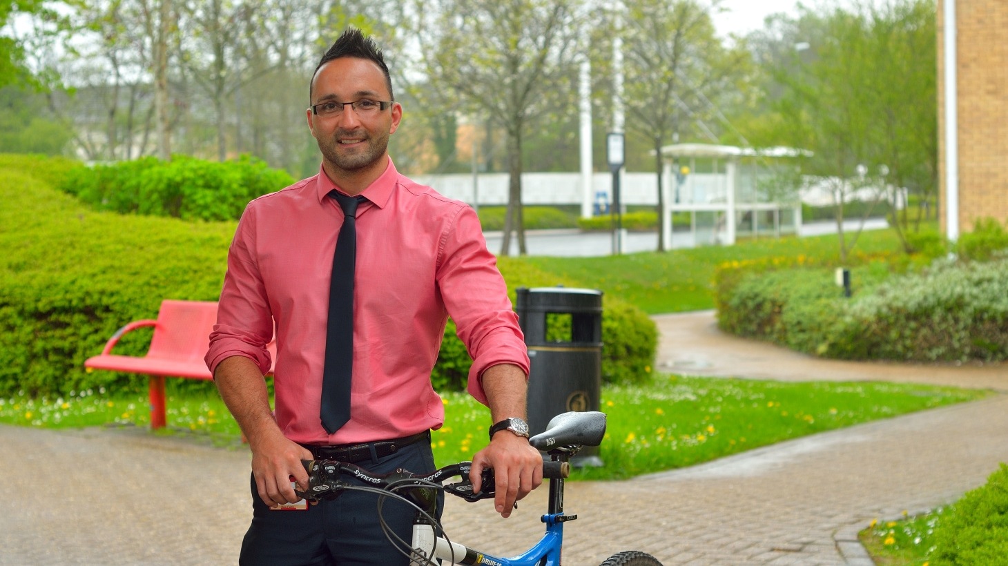 Office working standing with bike
