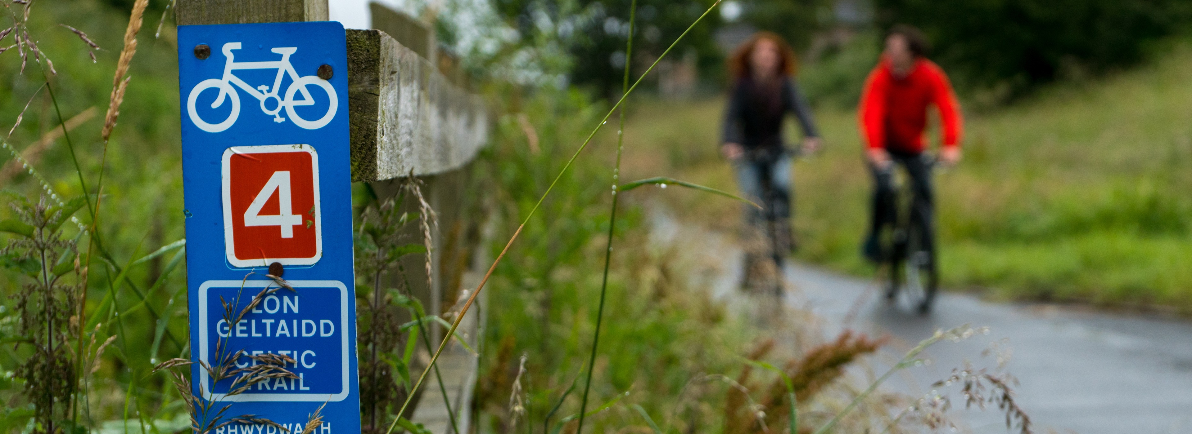 Celtic Trail sign, with two people on cycles, route 4, Wales