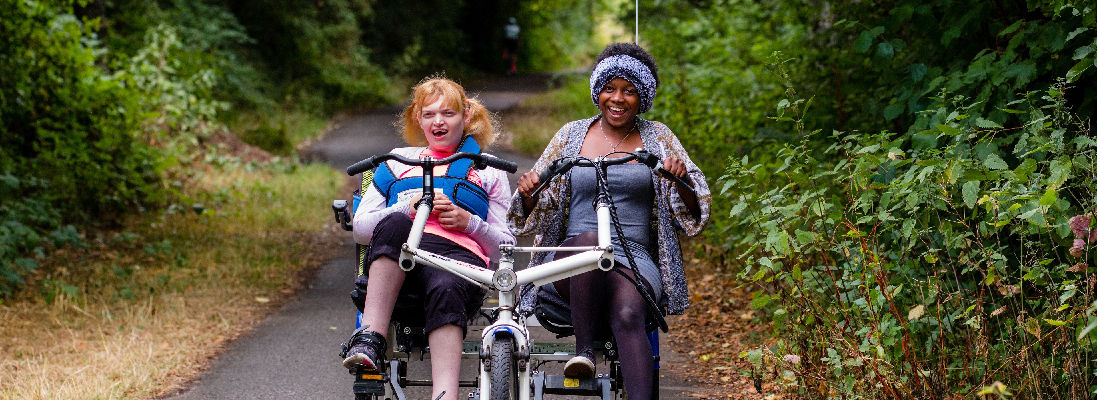 Adapted cycle riders on traffic-free path