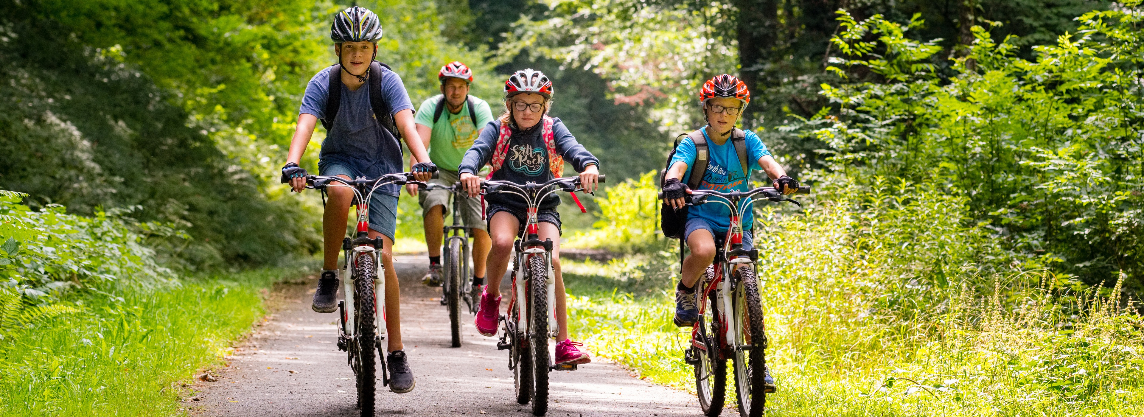 Family cycling on the Strawberry Line
