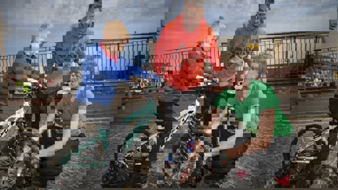 Walk Wheel Cycle Trust schools officer with dad and son on bike