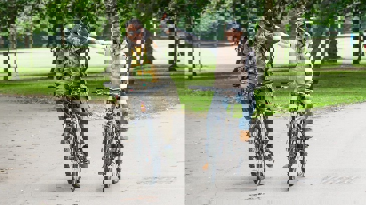 High-fiving cyclists