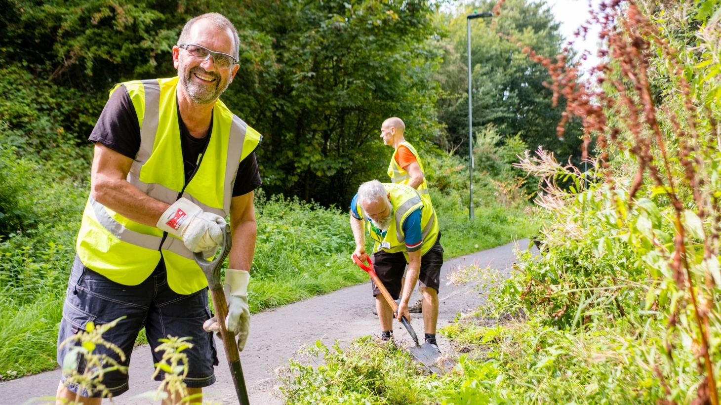 Volunteer widening the path on the National Cycle Network