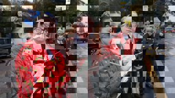 Children observing traffic and taking notes outside of school 