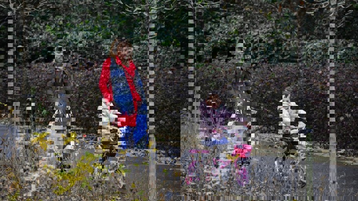 A mother and her daughter use a traffic-free cycle path for a shopping trip
