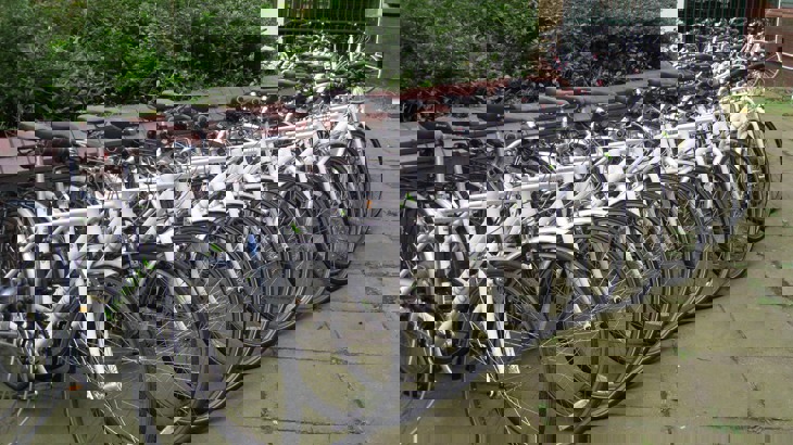 Row of hire bikes outside university building