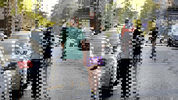 People walking and cycling on a road whilst social distancing