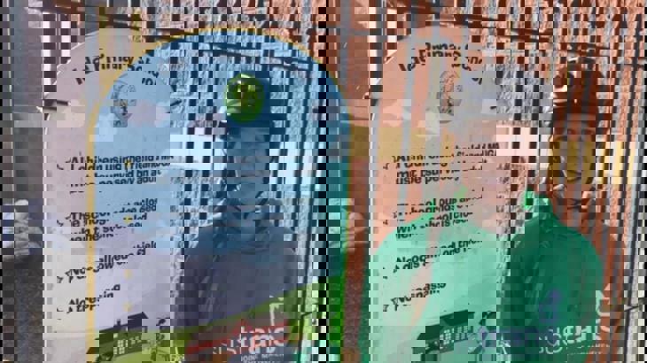 Walk Wheel Cycle Trust officer outside primary school gate 