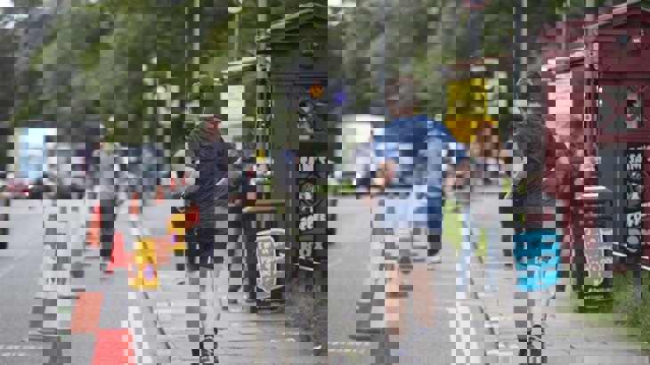 People practicing physical distancing on Bruntsfield Place following Spaces for People interventions