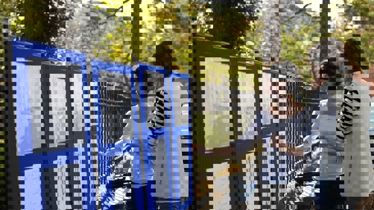 Two women look at street plans during community consultation 