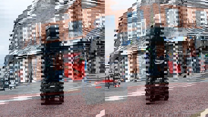 man in mobility scooter on the street