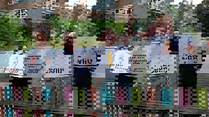 school children holding signs for air quality project 