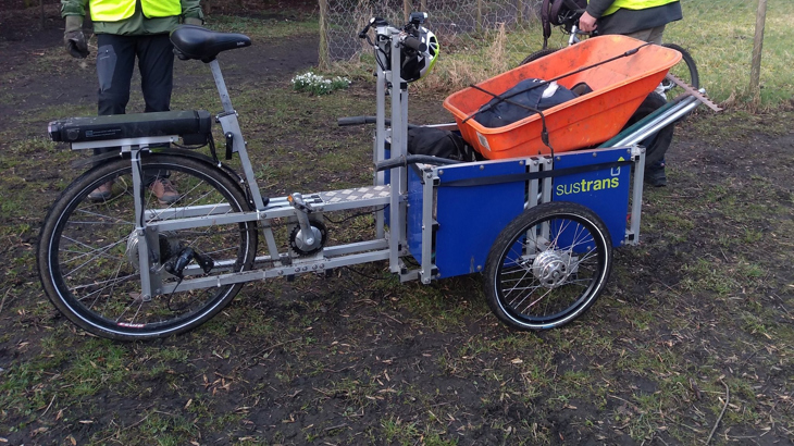 Cargo bike loaded with wheelbarrow