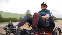 Debbie, a recumbent trike rider, cycling along the canal into Gloucester