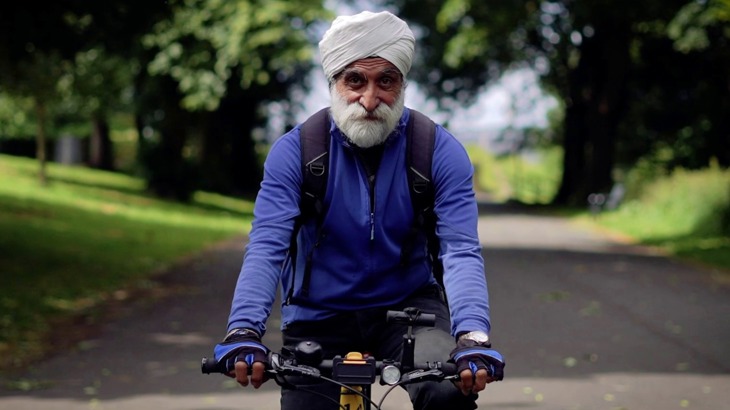 Satwant Singh cycling down a traffic free path on the National Cycle Network in Bradford