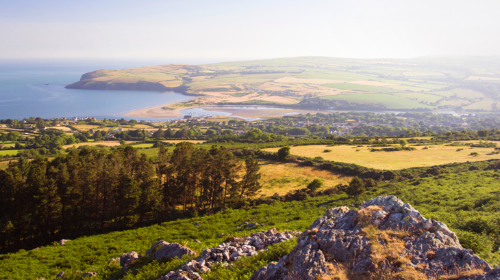 Rolling hills and moorland leading down to the Pembrokeshire coastline.
